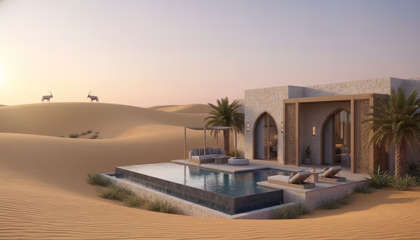 Desert luxury villa suite with private pool overlooking golden sand dunes and Arabian oryx in the distance at sunrise